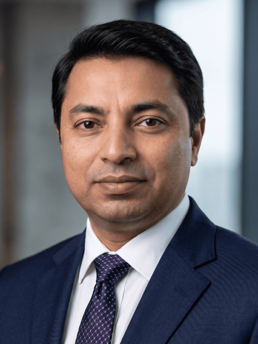 Manoj K Karn, Senior Vice President at Sai Ram Developers, photographed in a navy suit.
